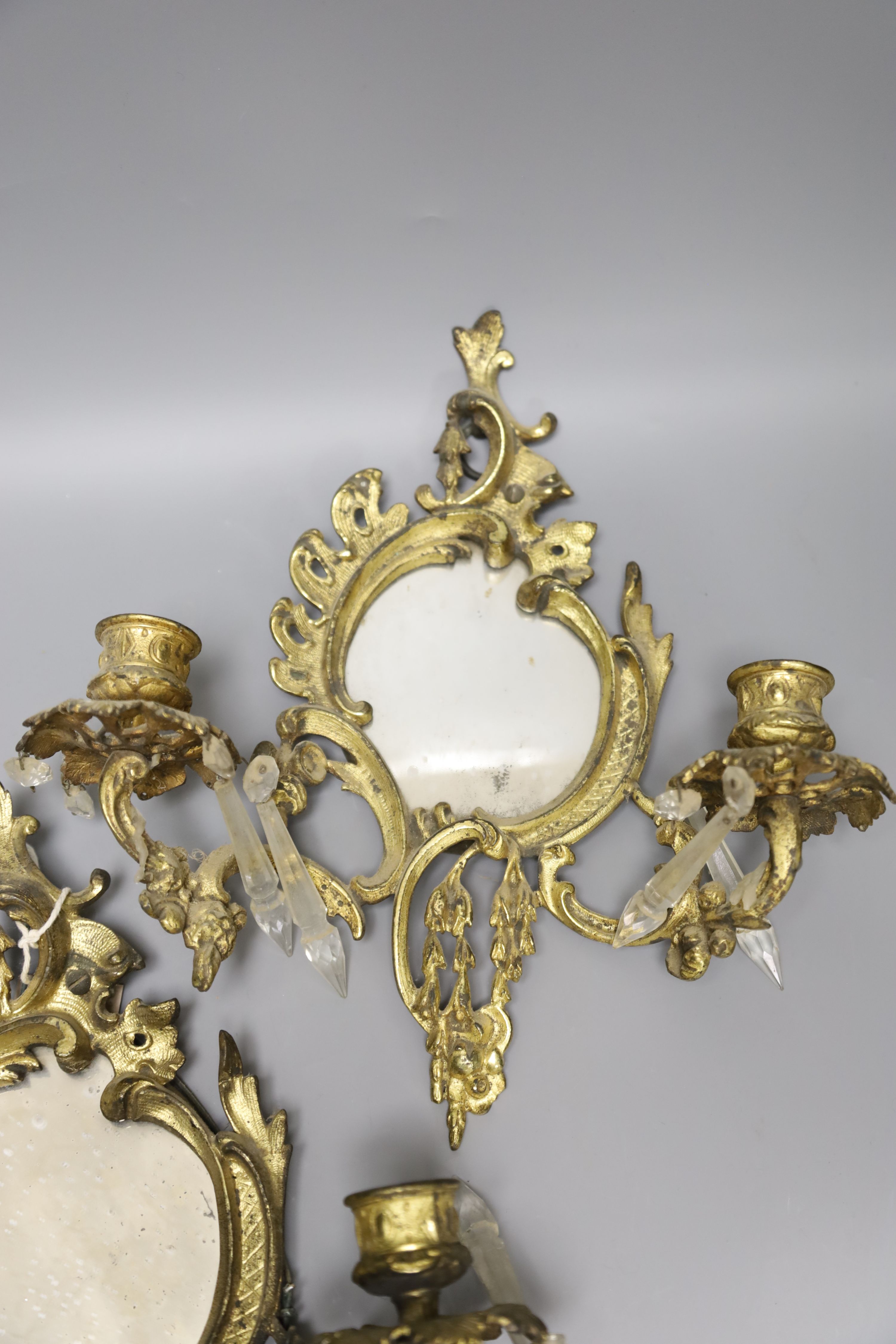 A pair of ormolu girandoles with lustres (a.f.)